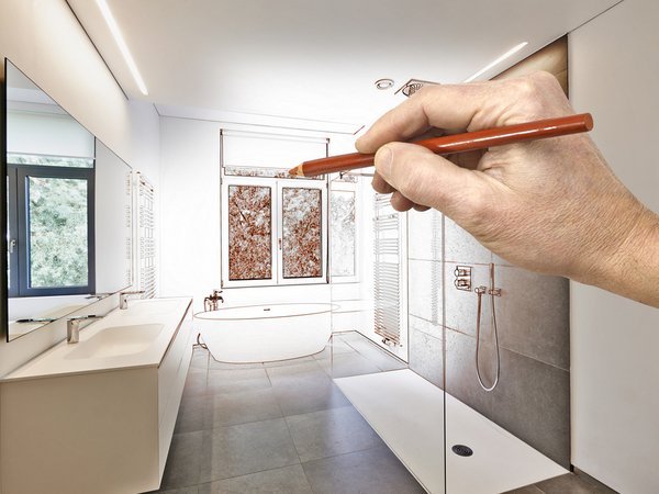 Hand drawing a bathroom remodel as the bathroom also becomes real