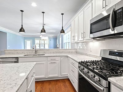Regular home kitchen with white cabinets