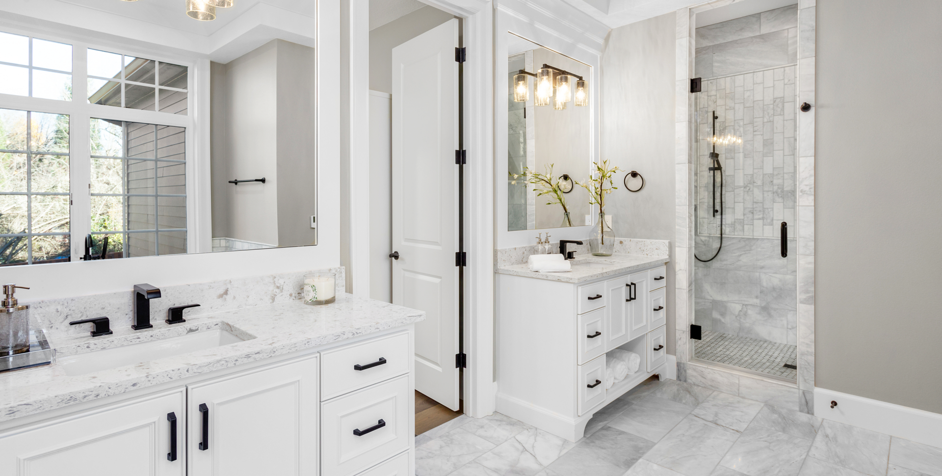 Large bathroom with marble tiles and double sinks