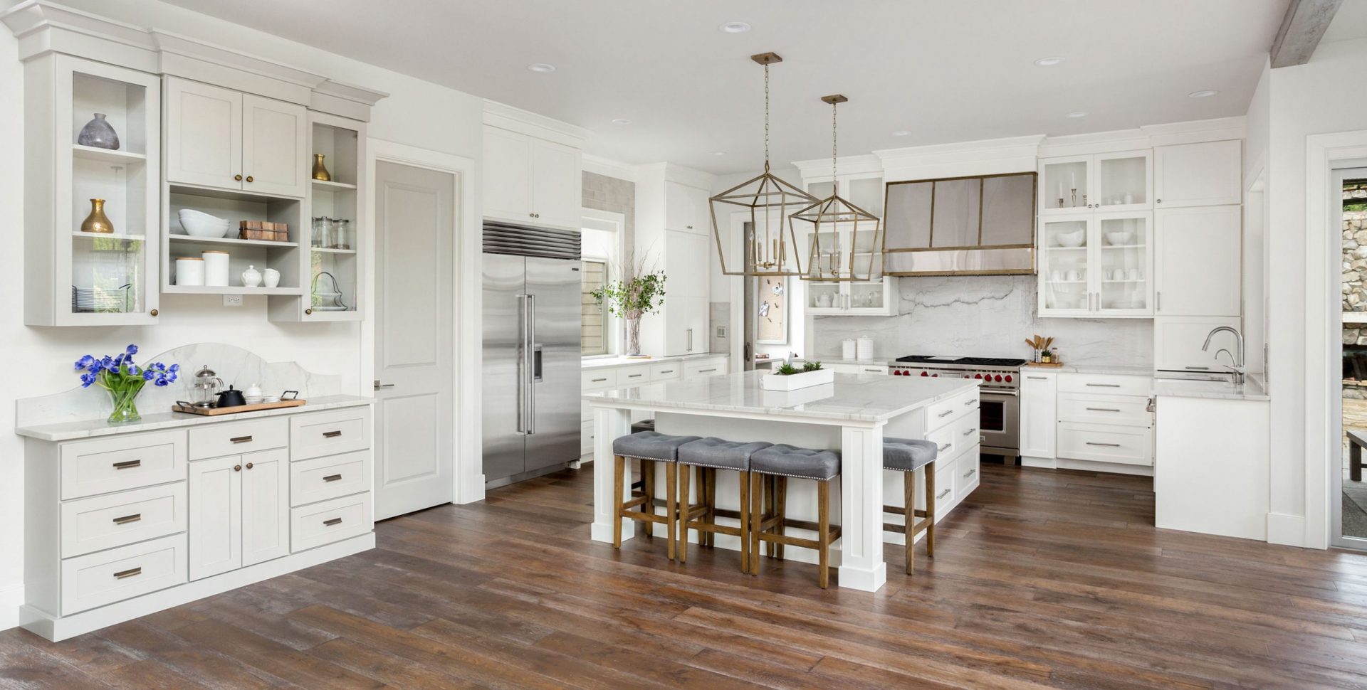 Large open space kitchen with white cabinets